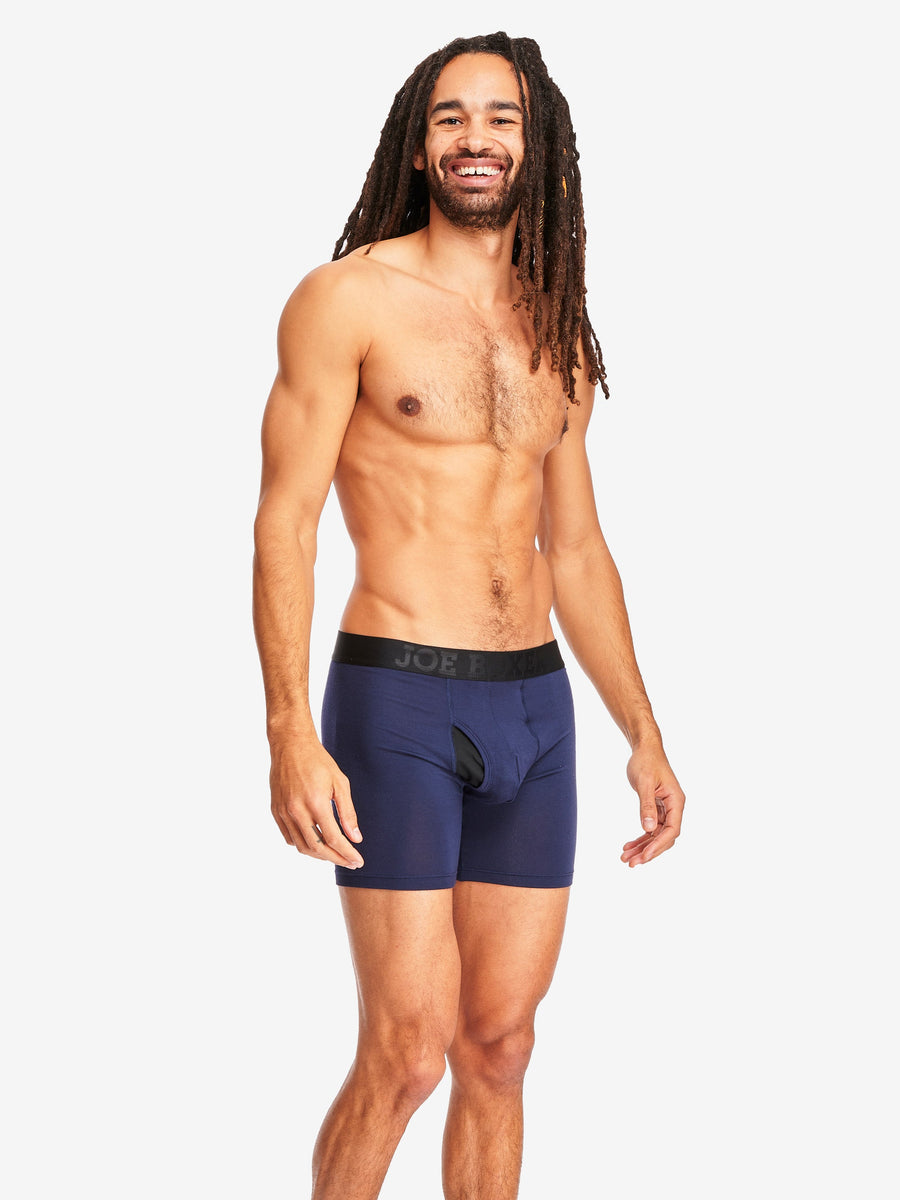 A young man wearing boxer shorts, knee … – Buy image – 11440954 ❘